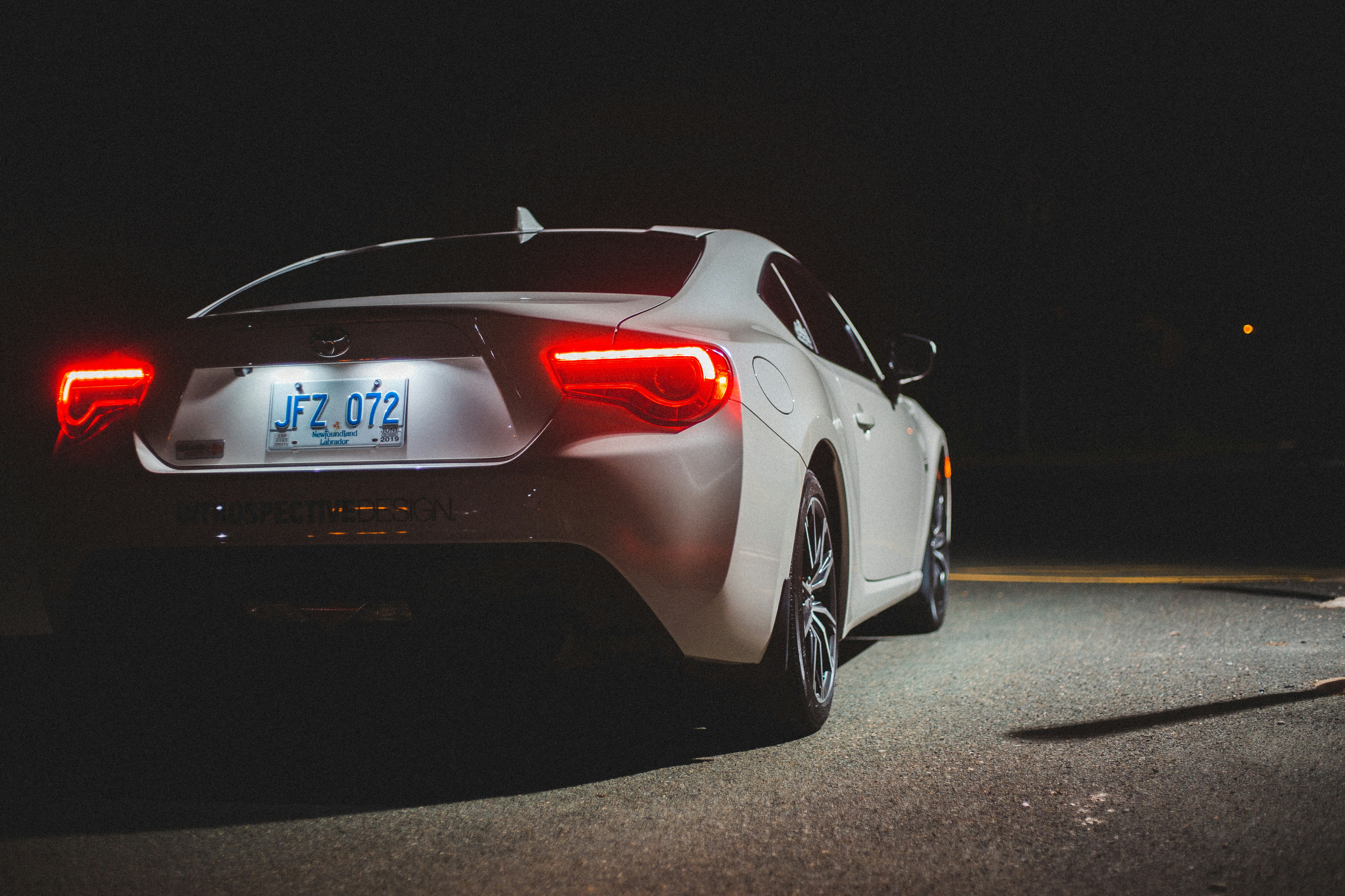 white porsche 911 on road during nighttime